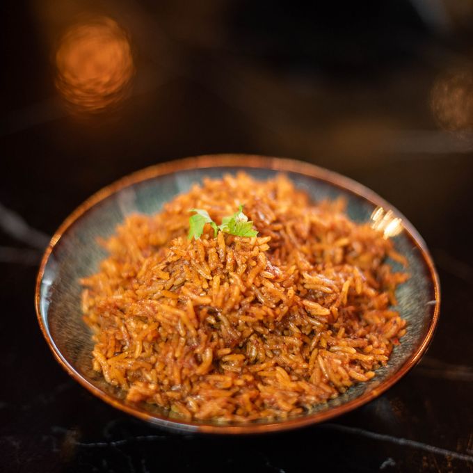 Jollof rice, cooked down slowly