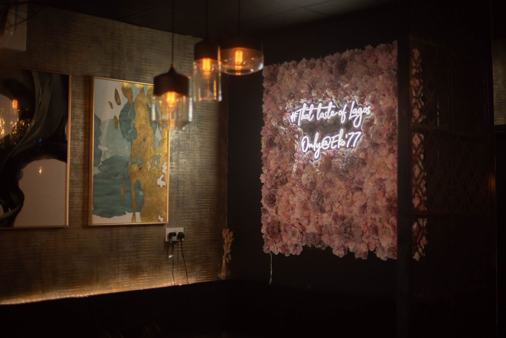 The dining room at ÉKO '77, with its neon sign